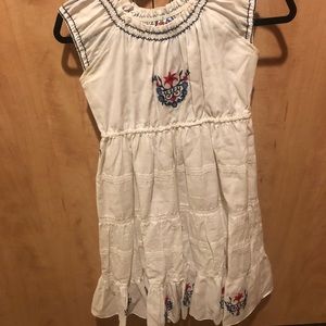 Summer dress. Elegant embroidery accompanied by smocked border.